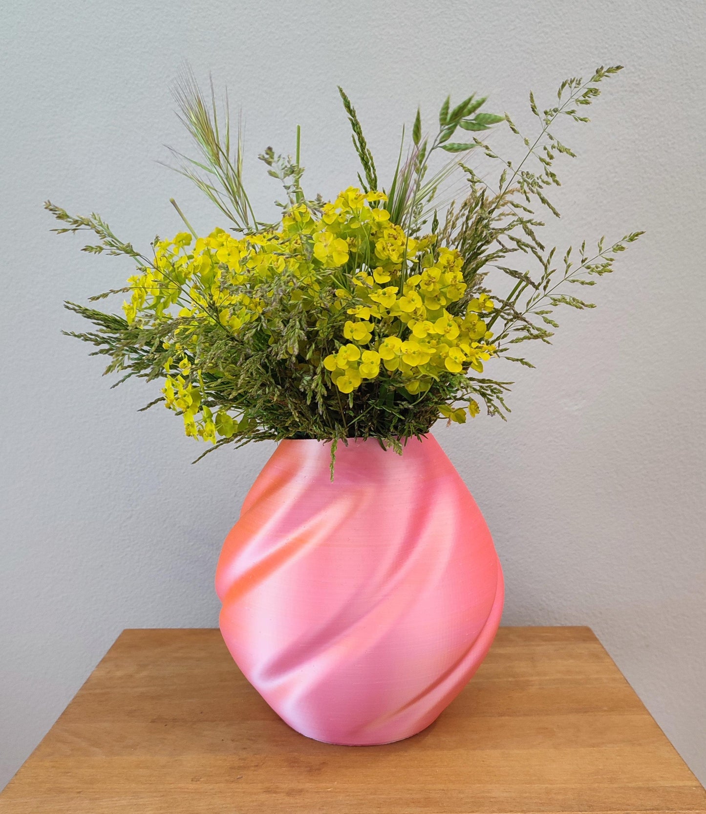 Modern, roomy vase, color with gradual pink-orange shading.