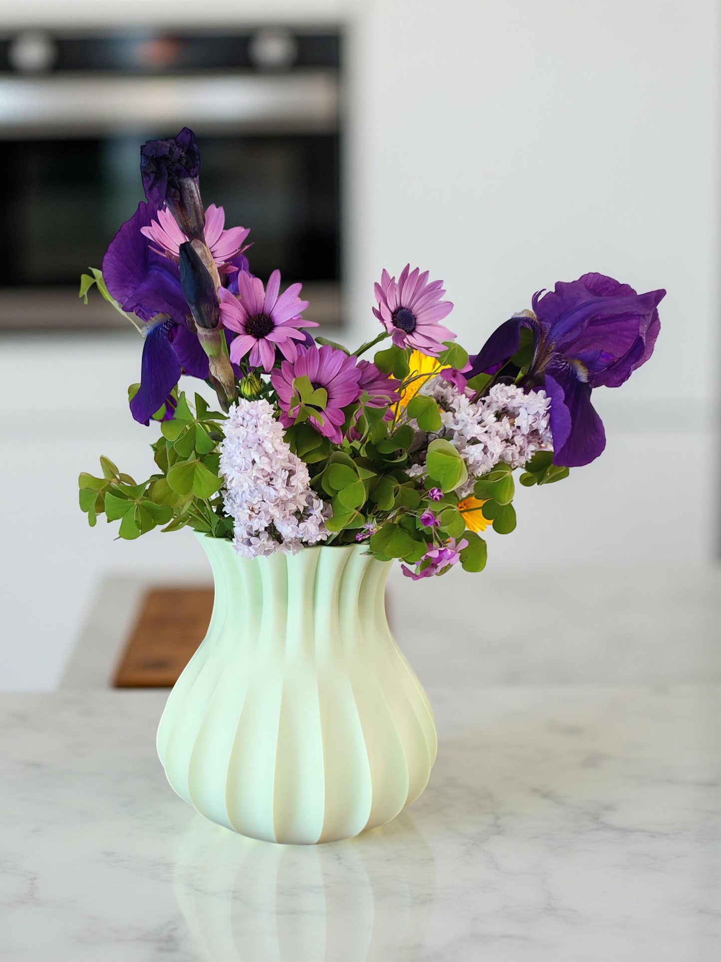 Modern, roomy vase, pastel light green color.