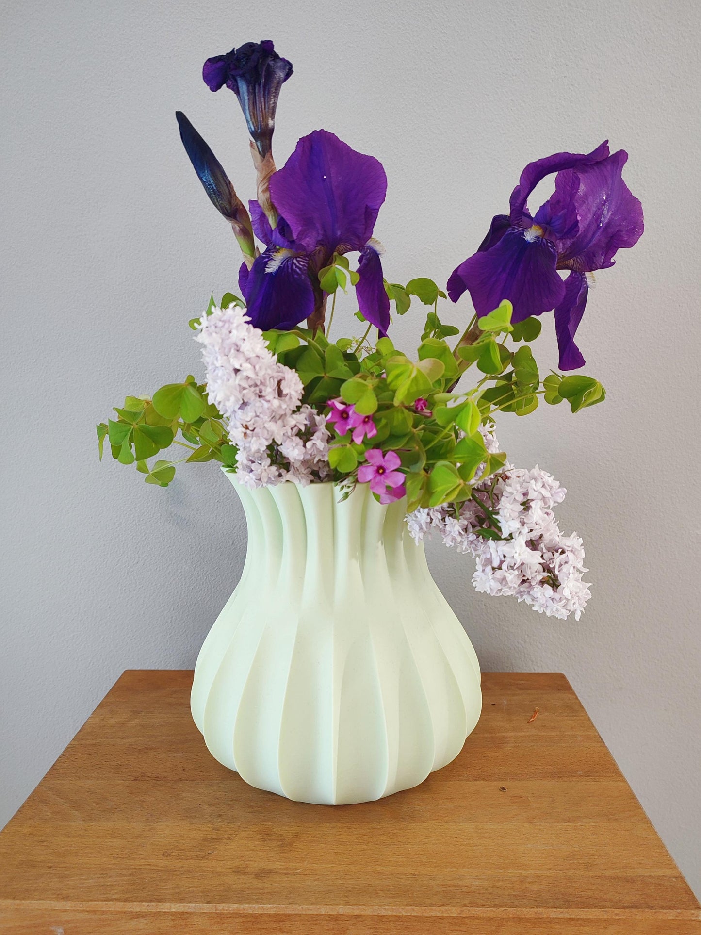 Modern, roomy vase, pastel light green color.