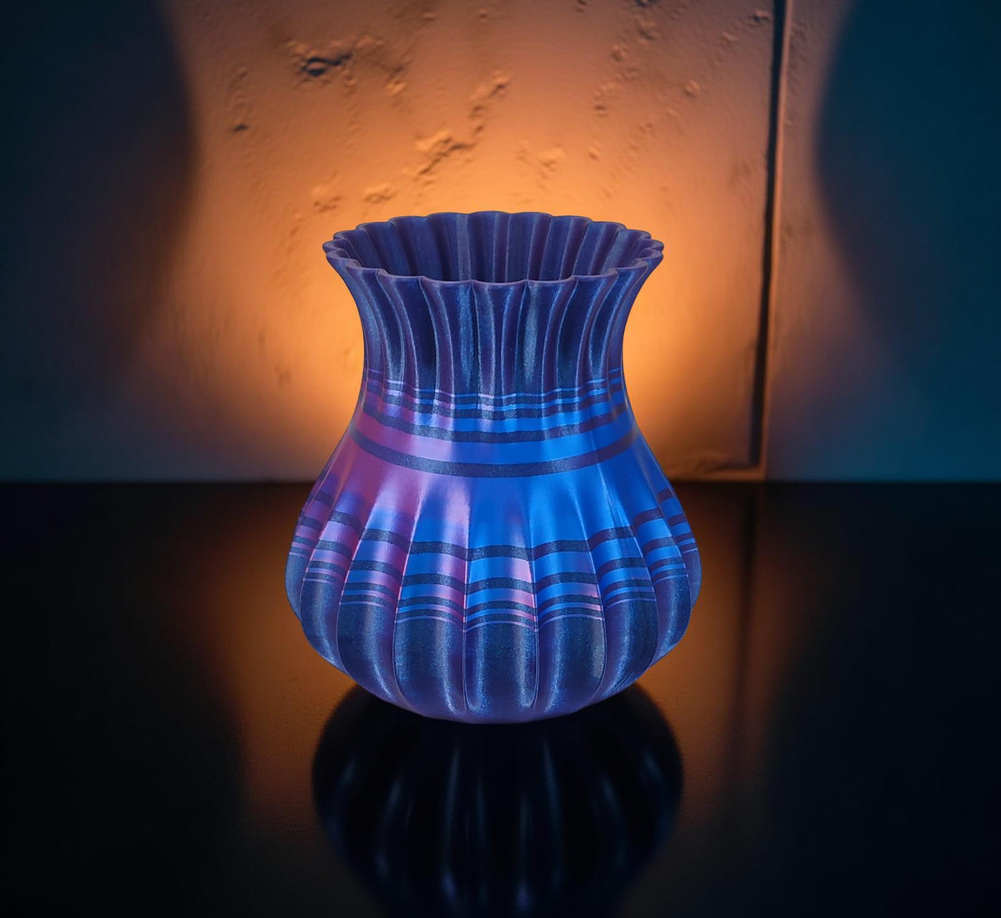 Modern, roomy, whimsical vase with variable color stripes.