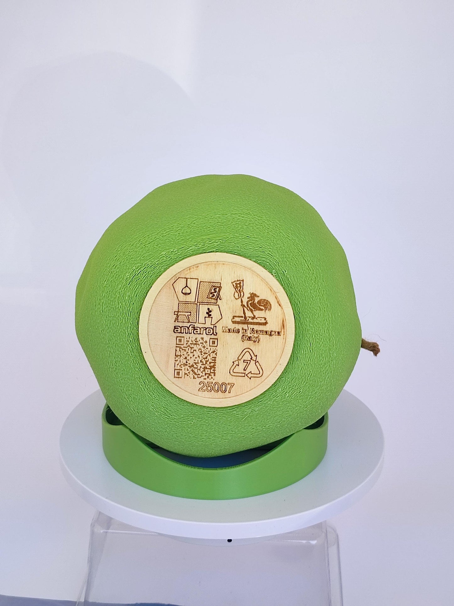 Modern, whimsical, pastel green vase in the shape of a bag.