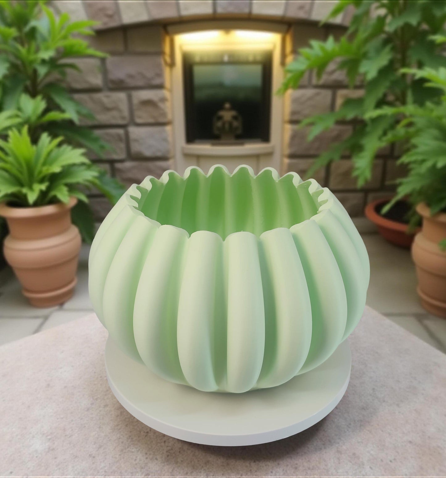 Modern, roomy, pumpkin-shaped vase, light pastel green.