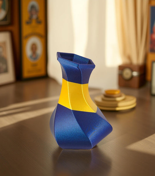 Modern, whimsical vase, glittery blue and golden yellow.