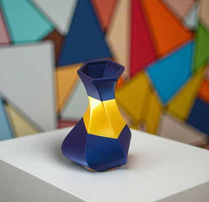Modern, whimsical vase, glittery blue and golden yellow.