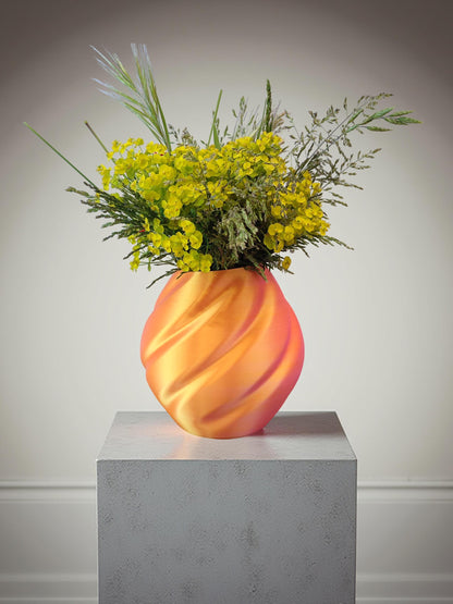 Modern, roomy vase, color with gradual pink-orange shading.