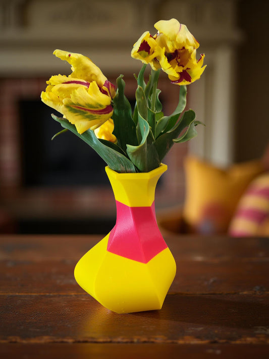 Modern, whimsical vase, yellow and red colors.