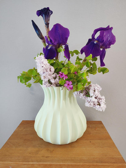 Modern, roomy vase, pastel light green color.