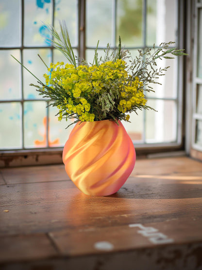 Modern, roomy vase, color with gradual pink-orange shading.