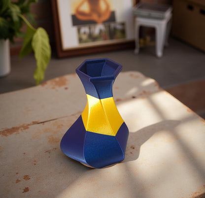 Modern, whimsical vase, glittery blue and golden yellow.