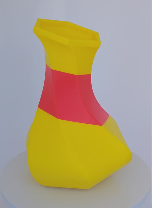 Modern, whimsical vase, yellow and red colors.