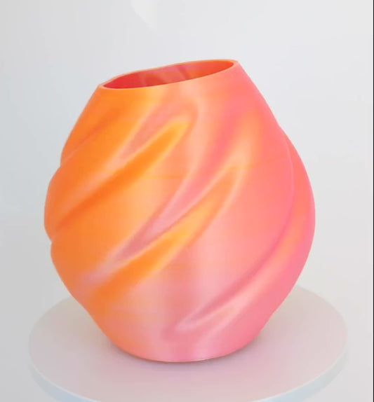 Modern, roomy vase, color with gradual pink-orange shading.