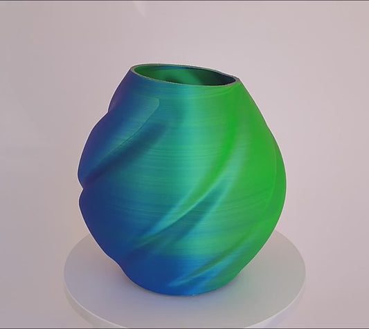 Modern, roomy, whimsical, green, blue and purple vase.