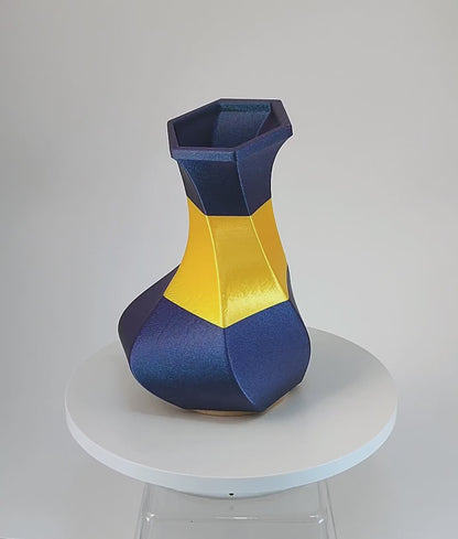 Modern, whimsical vase, glittery blue and golden yellow.
